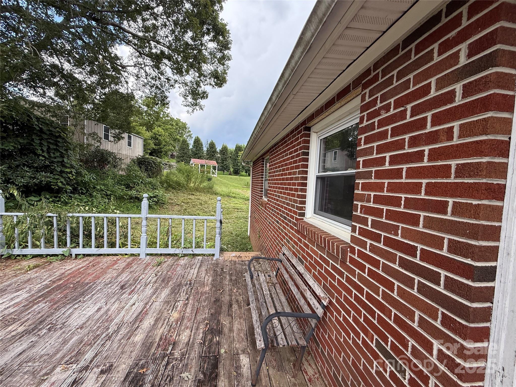 183 Maple Road Spruce Pine, NC 28777 - Photo 11 of 30 a view of a house with a wooden floor