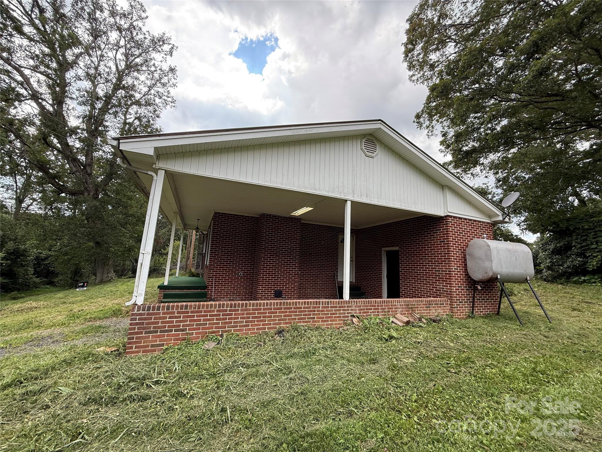 183 Maple Road Spruce Pine, NC 28777 - Photo 13 of 30 a view of a house with a yard