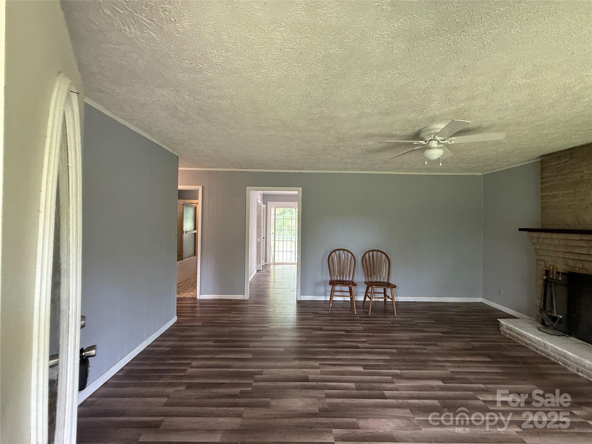 183 Maple Road Spruce Pine, NC 28777 - Photo 14 of 30 a view of a livingroom with wooden floor and furniture