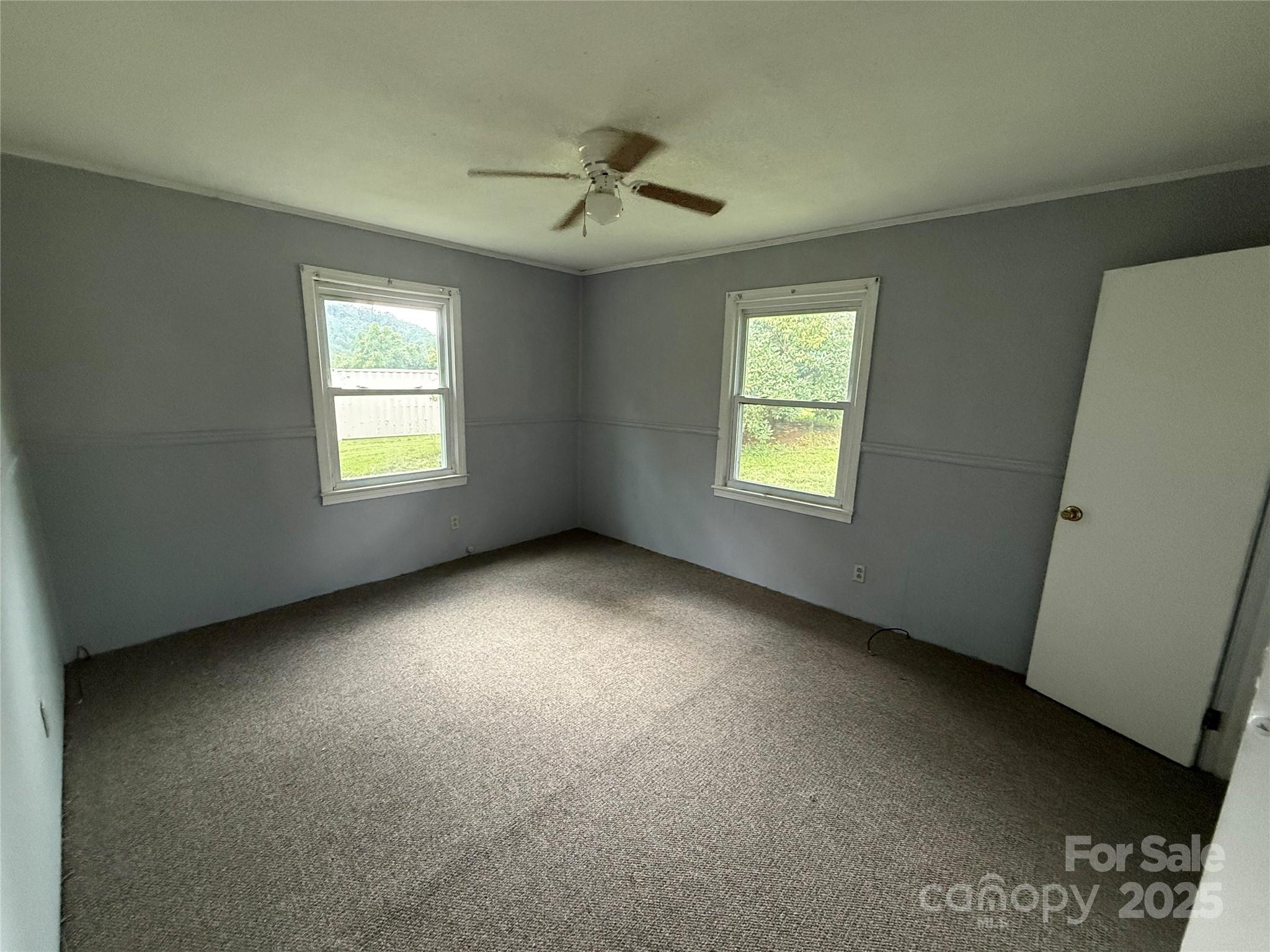 183 Maple Road Spruce Pine, NC 28777 - Photo 21 of 30 a view of an empty room with a window