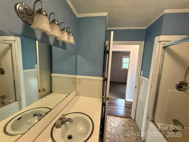 a bathroom with a sink and mirror