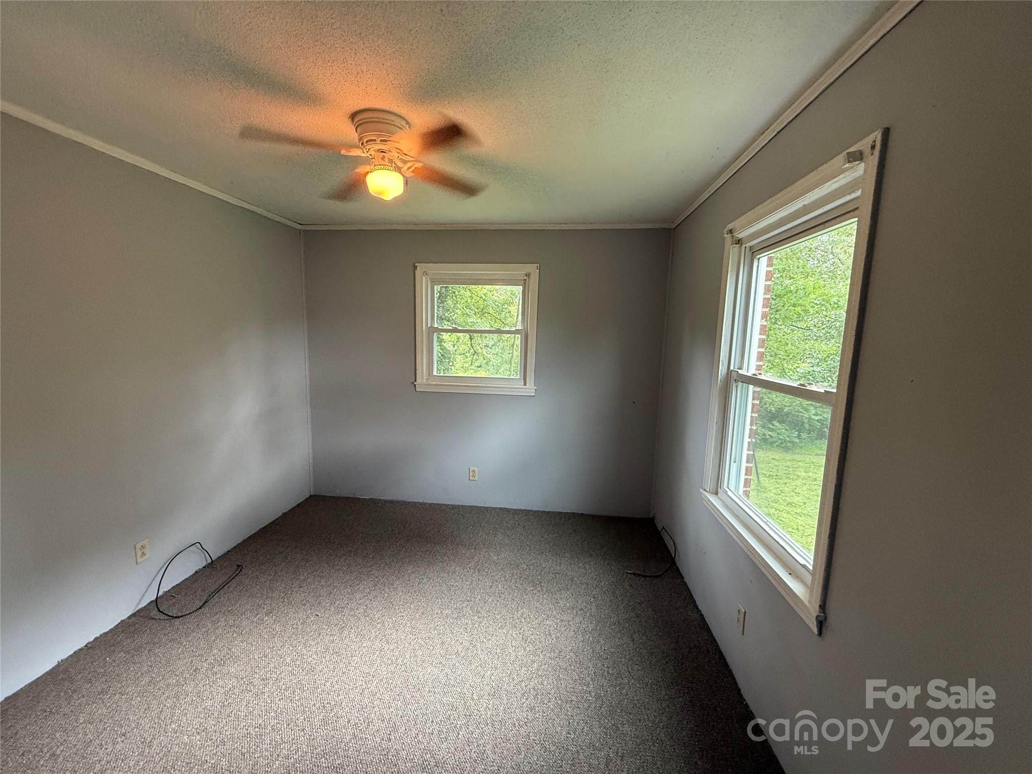 183 Maple Road Spruce Pine, NC 28777 - Photo 26 of 30 a view of an empty room with a window