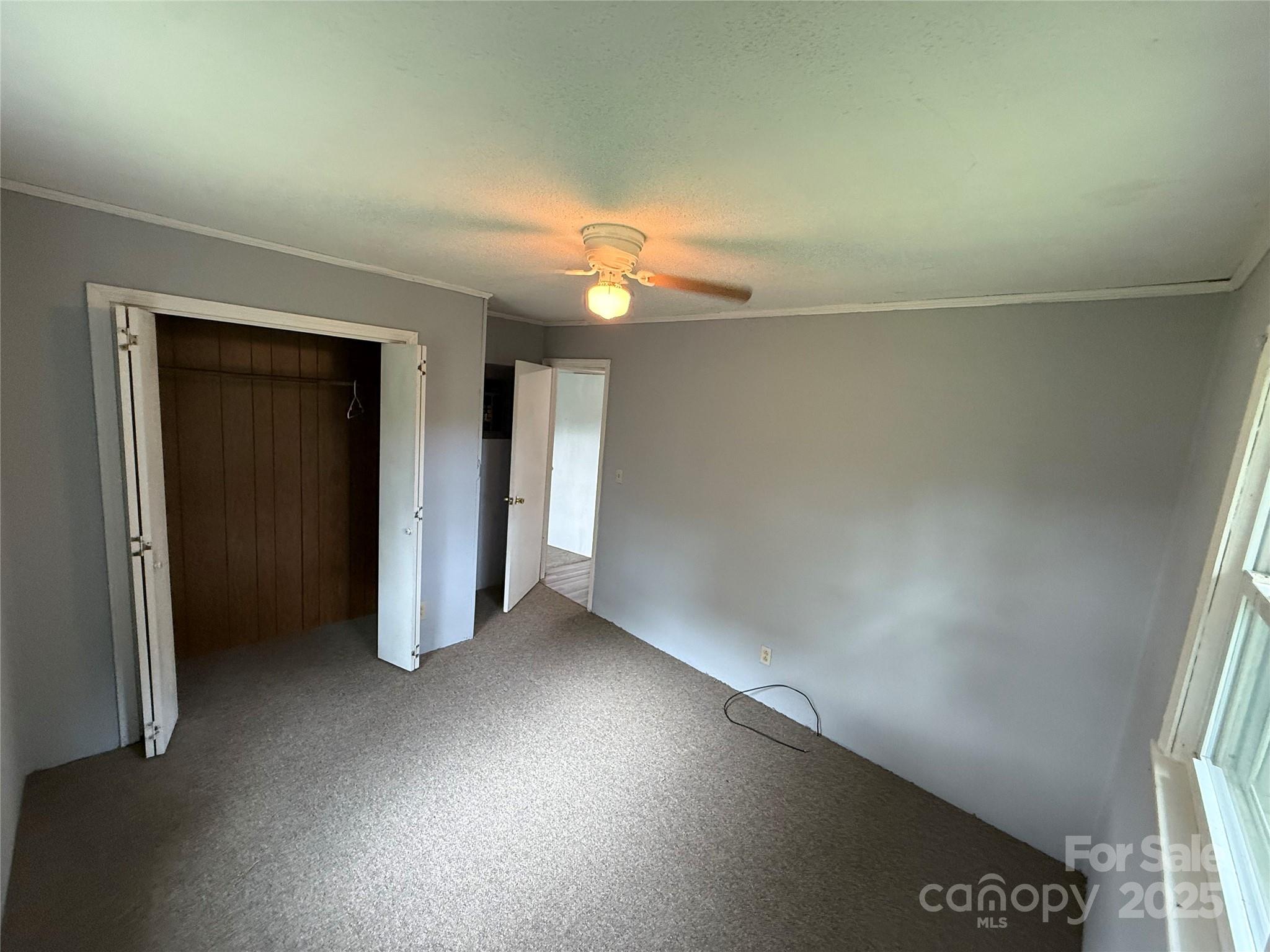 183 Maple Road Spruce Pine, NC 28777 - Photo 27 of 30 wooden floor in an empty room with a window