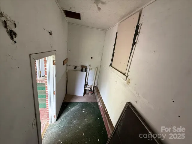 a view of a hallway with staircase