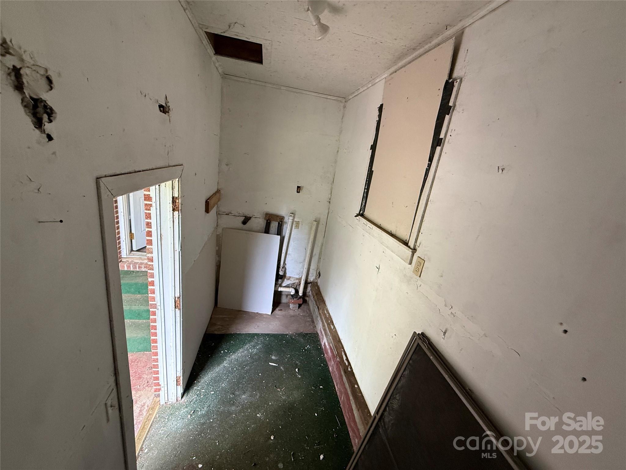 183 Maple Road Spruce Pine, NC 28777 - Photo 29 of 30 a view of a hallway with staircase
