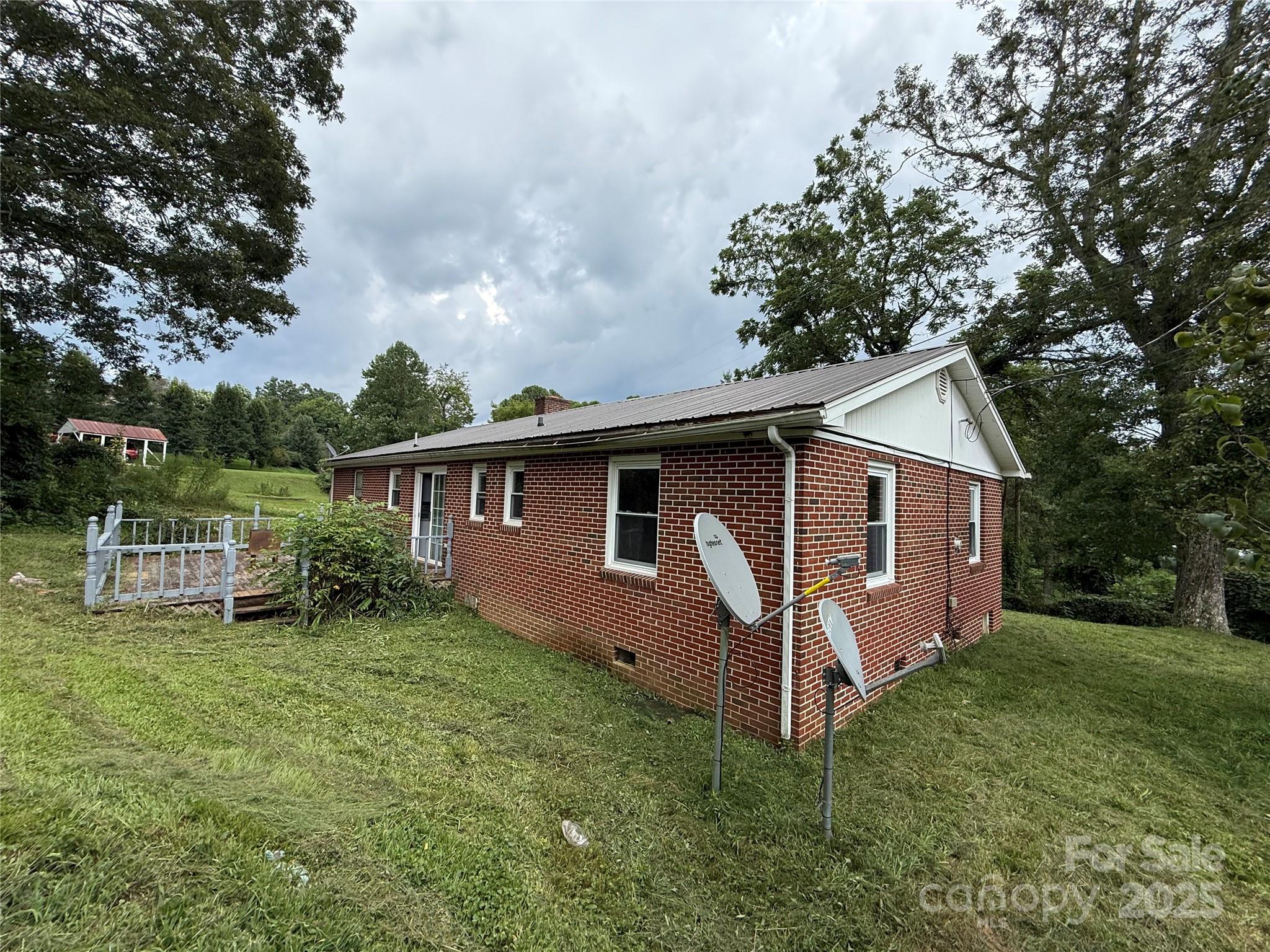183 Maple Road Spruce Pine, NC 28777 - Photo 5 of 30 a view of backyard of house with green space