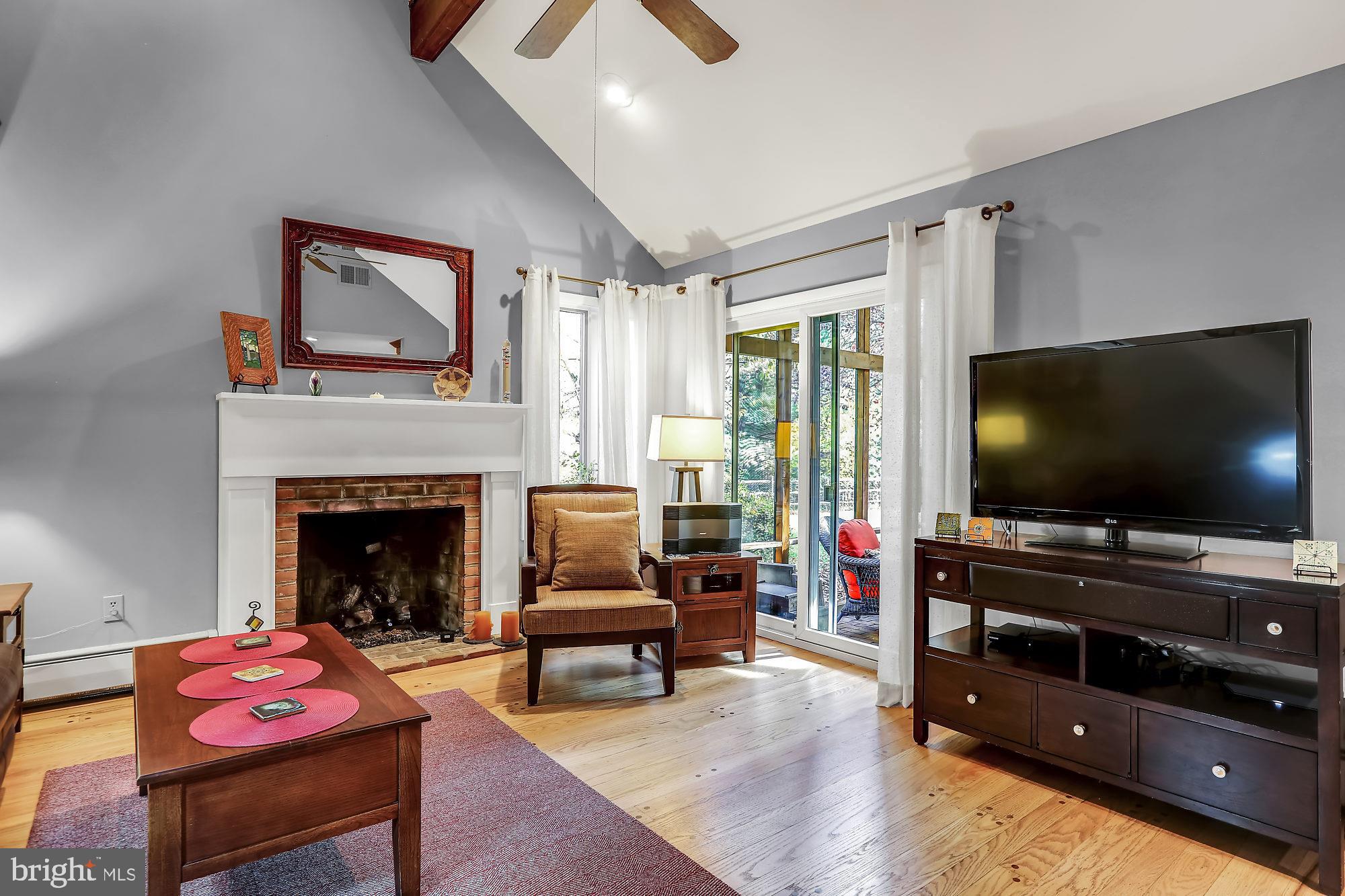 5127 New Road New Hope, PA 18938 - Photo 15 of 37 Family room with gas fireplace leads to porch