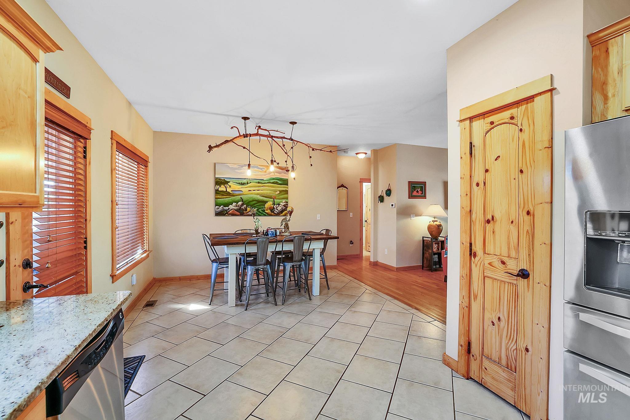 12954 Upland Road Donnelly, ID 83615 - Photo 13 of 41 Dining space with light tile patterned flooring