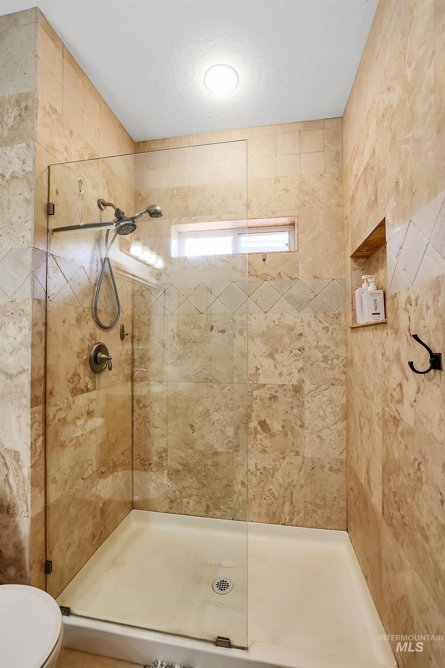 12954 Upland Road Donnelly, ID 83615 - Photo 19 of 41 Full bath featuring toilet and a stall shower