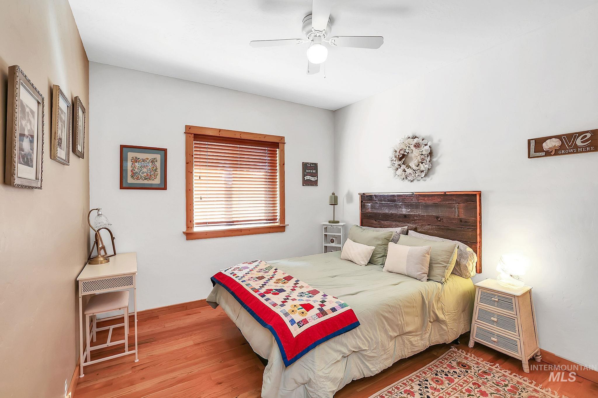 12954 Upland Road Donnelly, ID 83615 - Photo 20 of 41 Bedroom with ceiling fan and light wood-style flooring