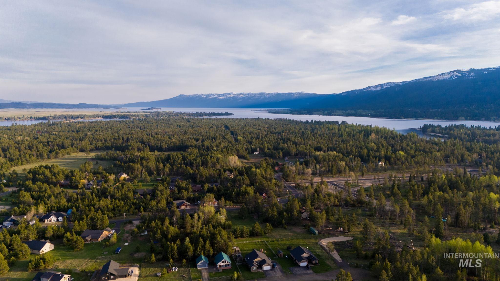 12954 Upland Road Donnelly, ID 83615 - Photo 39 of 41 Drone / aerial view of a heavily wooded area and a water and mountain view