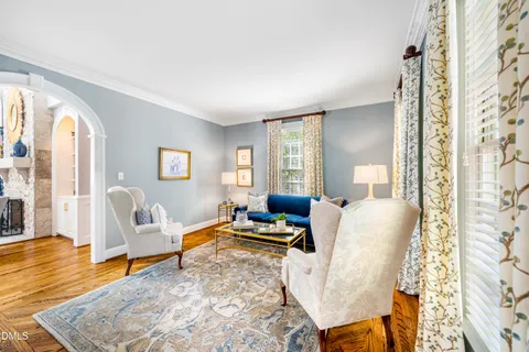 a large kitchen with kitchen island a island a stove a sink a dining table and chairs