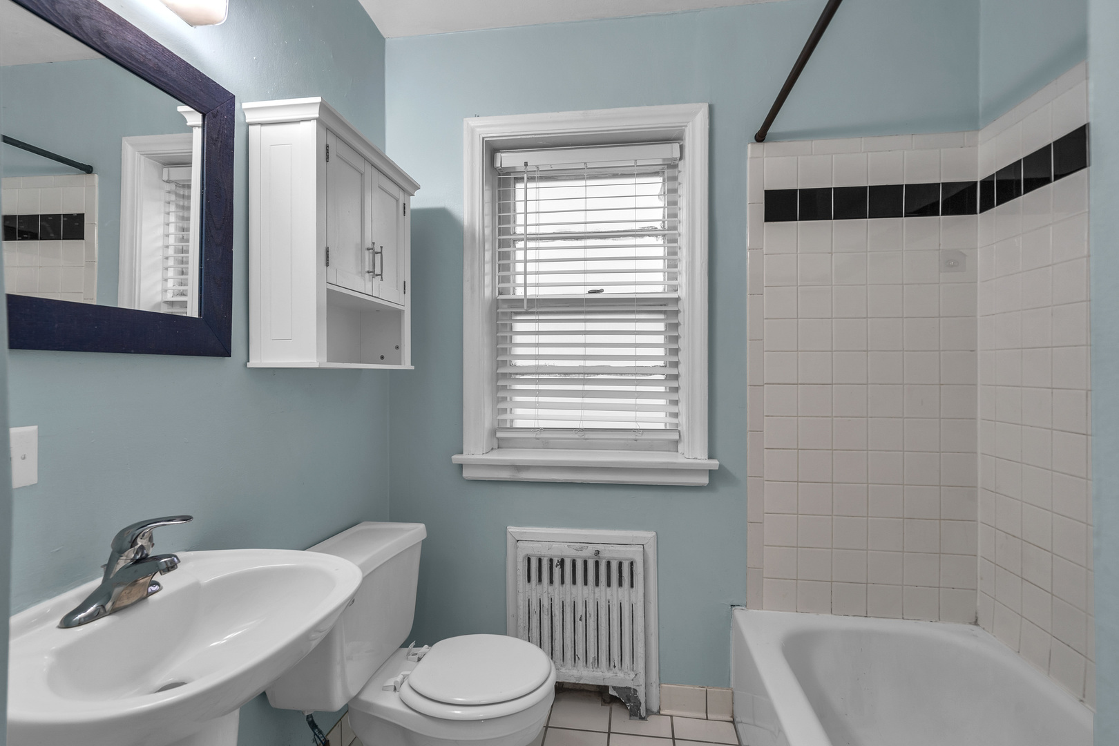 530 Michigan Avenue, Unit 3E Evanston, IL 60202 - Photo 10 of 19 a bathroom with a sink toilet a mirror and shower