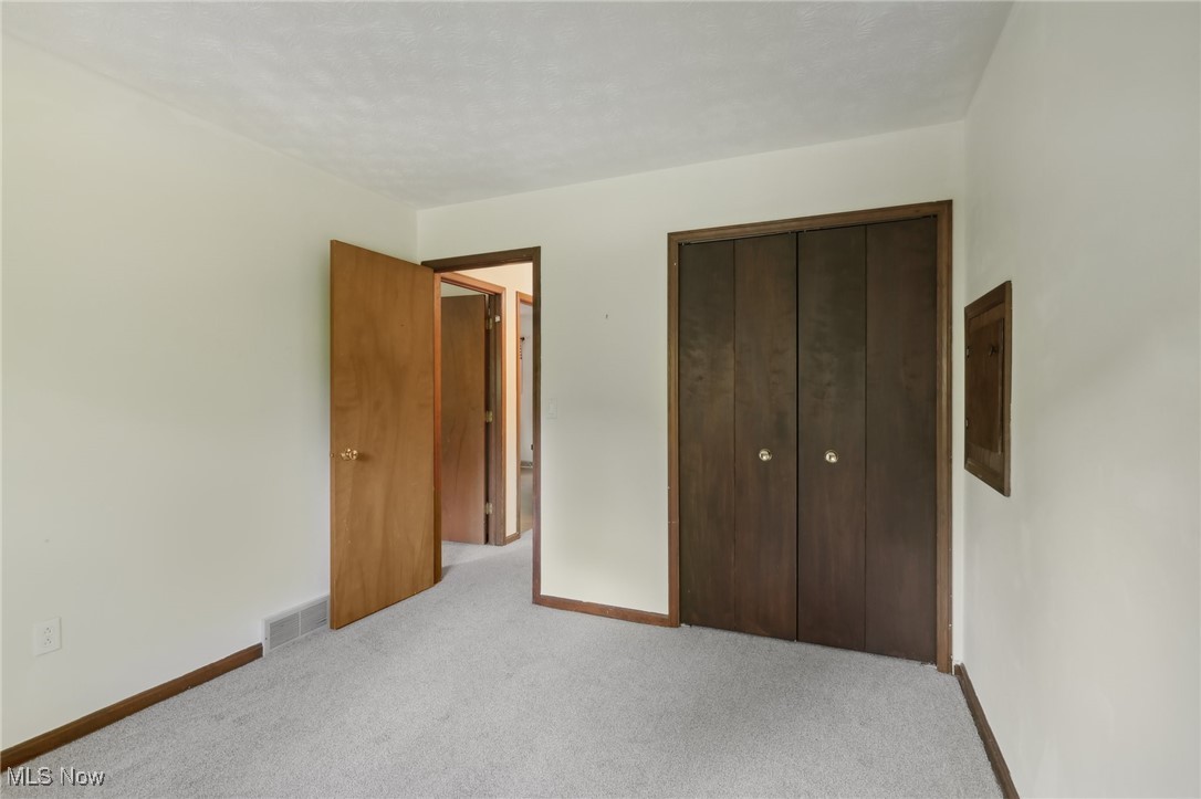 5845 Carsten Road Medina, OH 44256 - Photo 32 of 37 Unfurnished bedroom with a closet and light colored carpet