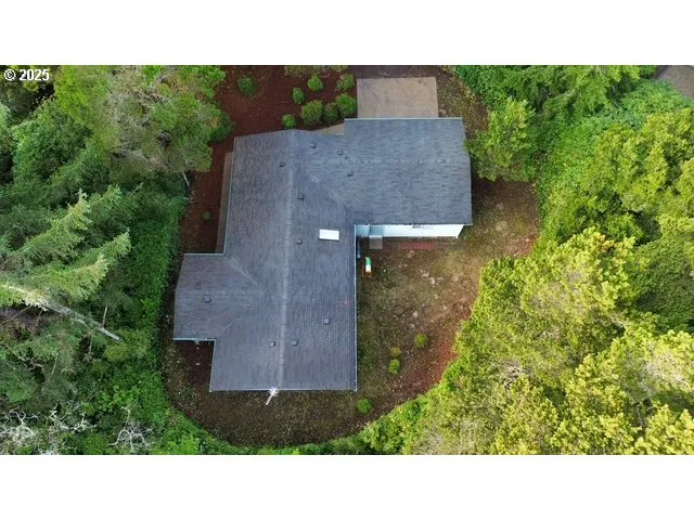 a view of a livingroom with an empty space and a fireplace