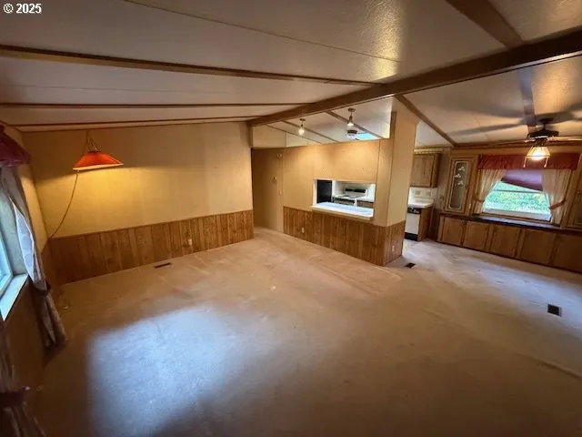 a view of a garage with wooden floor and a window