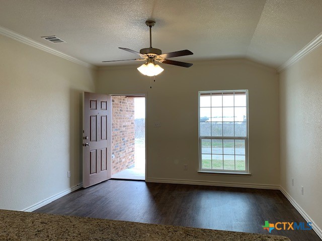 279 Olaf Drive Temple, TX 76504 - Photo 2 of 14 a view of an empty room with window and wooden floor