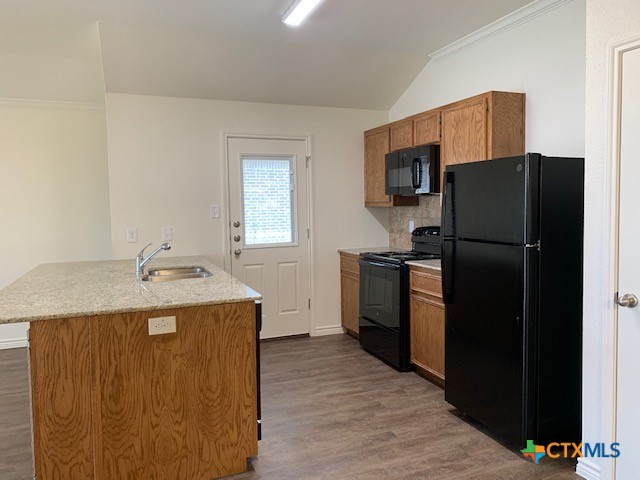 279 Olaf Drive Temple, TX 76504 - Photo 4 of 14 a kitchen with a refrigerator sink and stove