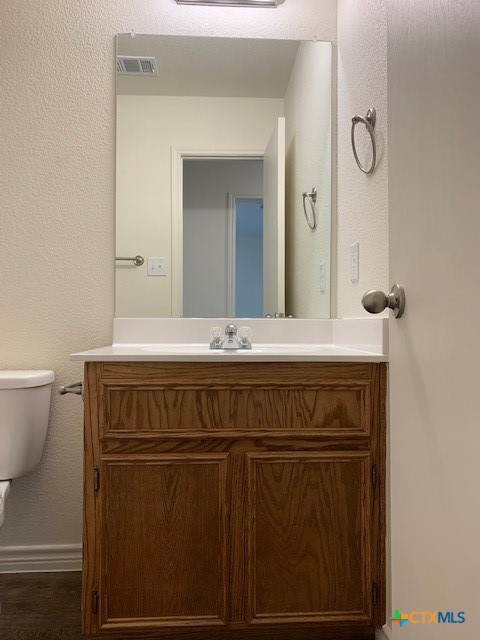 279 Olaf Drive Temple, TX 76504 - Photo 9 of 14 a bathroom with a sink a toilet and mirror