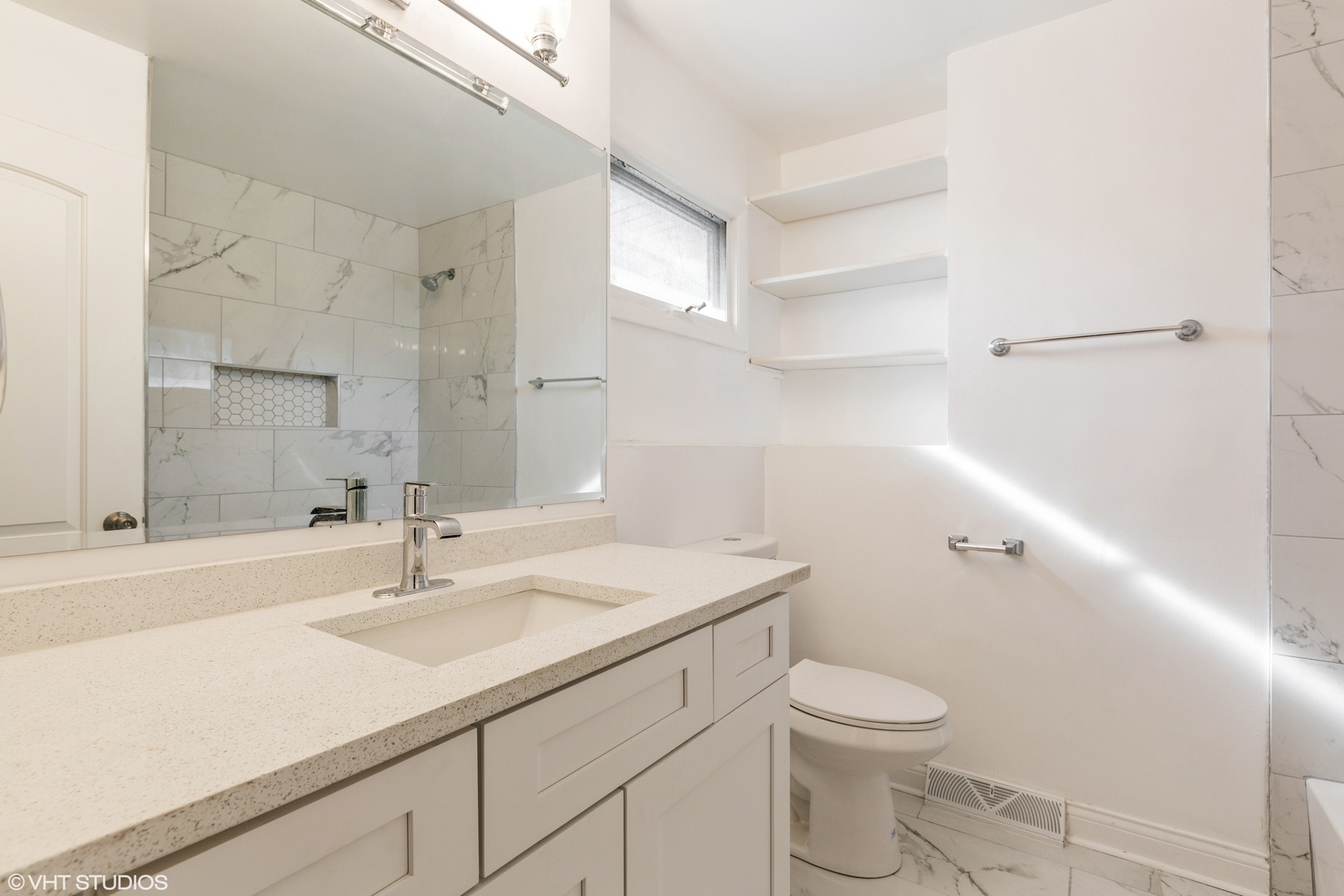 17618 Maple Avenue Country Club Hills, IL 60478 - Photo 11 of 14 a bathroom with a sink toilet and vanity