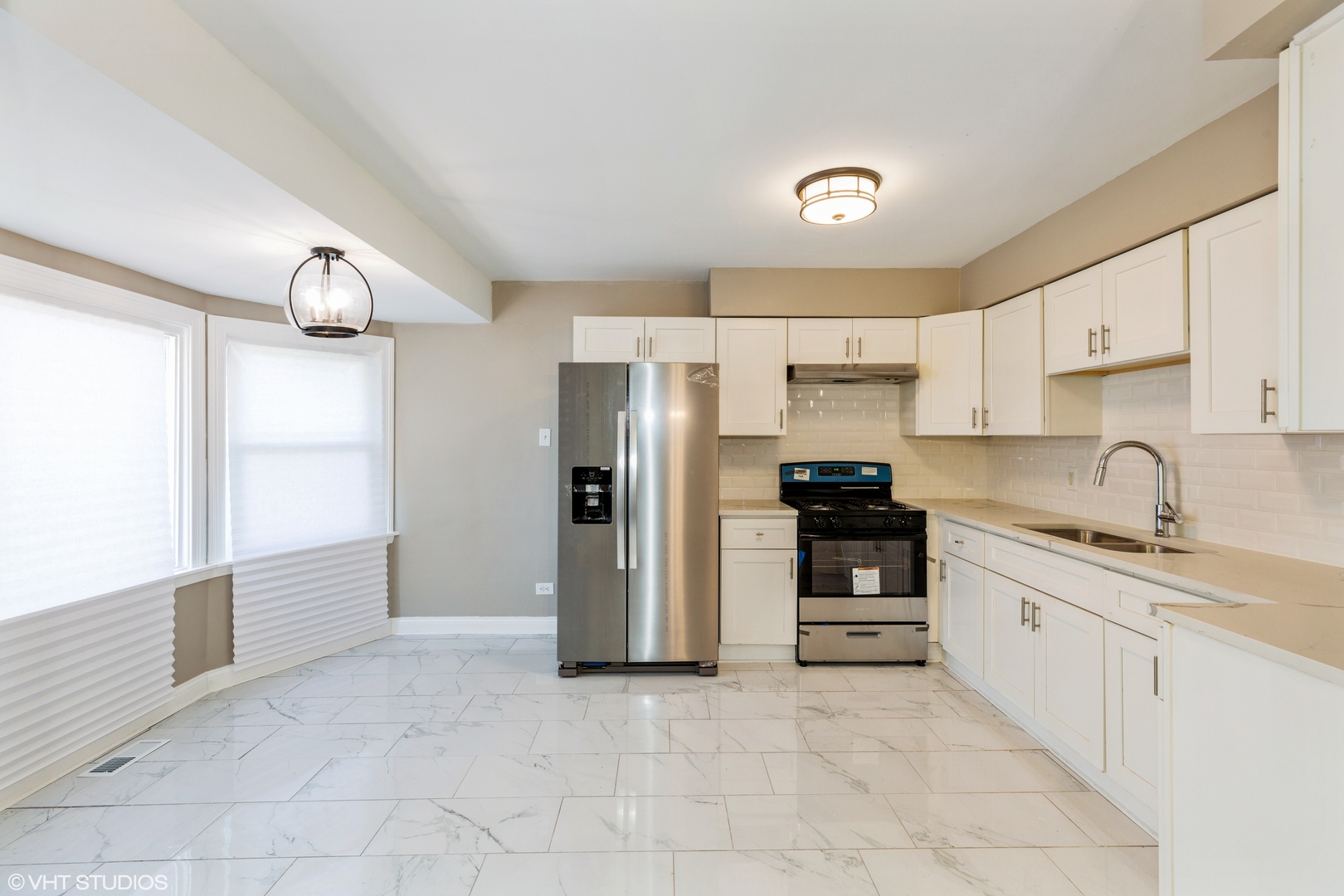 17618 Maple Avenue Country Club Hills, IL 60478 - Photo 4 of 14 a kitchen with stainless steel appliances granite countertop a refrigerator and a sink