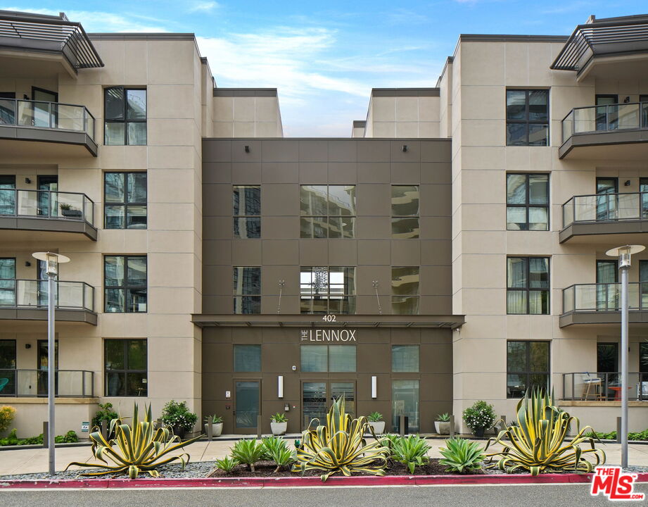 402 Rockefeller, Unit 406 Irvine, CA 92612 - Photo 1 of 33 a front view of a multi story residential apartment building