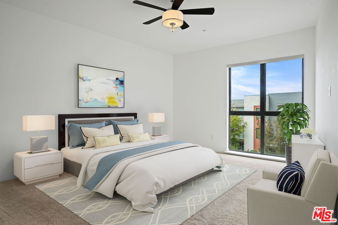 402 Rockefeller, Unit 406 Irvine, CA 92612 - Photo 15 of 33 a bedroom with furniture and a large window