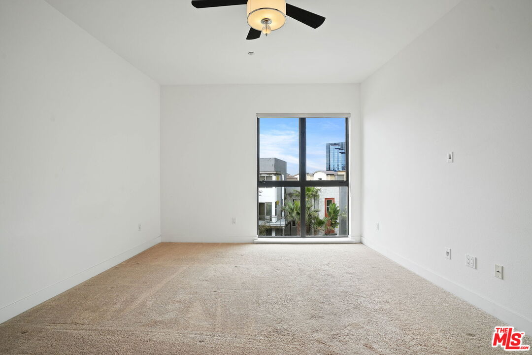 402 Rockefeller, Unit 406 Irvine, CA 92612 - Photo 16 of 33 an empty room with a window