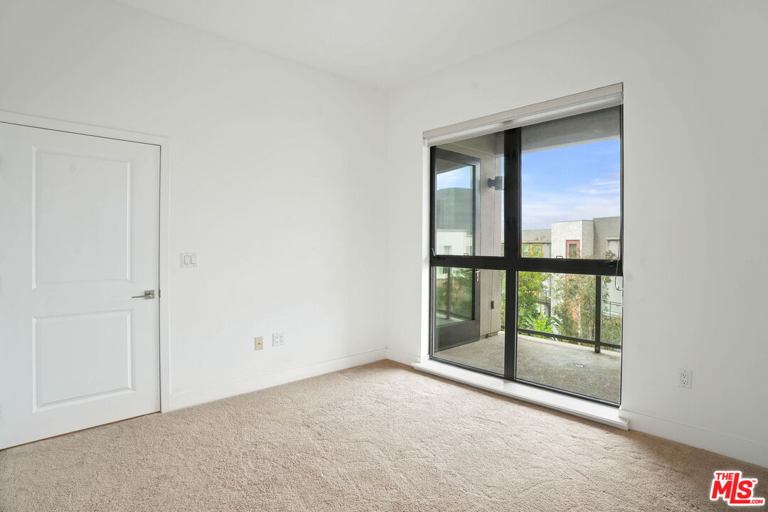 402 Rockefeller, Unit 406 Irvine, CA 92612 - Photo 17 of 33 a view of an empty room with a window