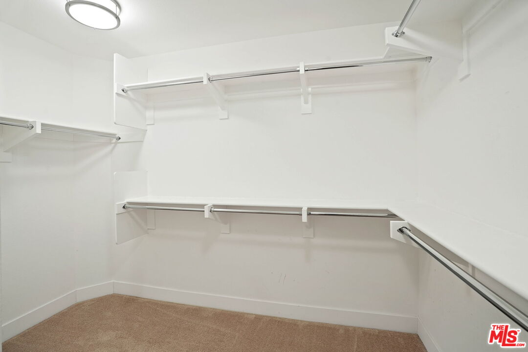 402 Rockefeller, Unit 406 Irvine, CA 92612 - Photo 24 of 33 a view of a room with racks on the wall