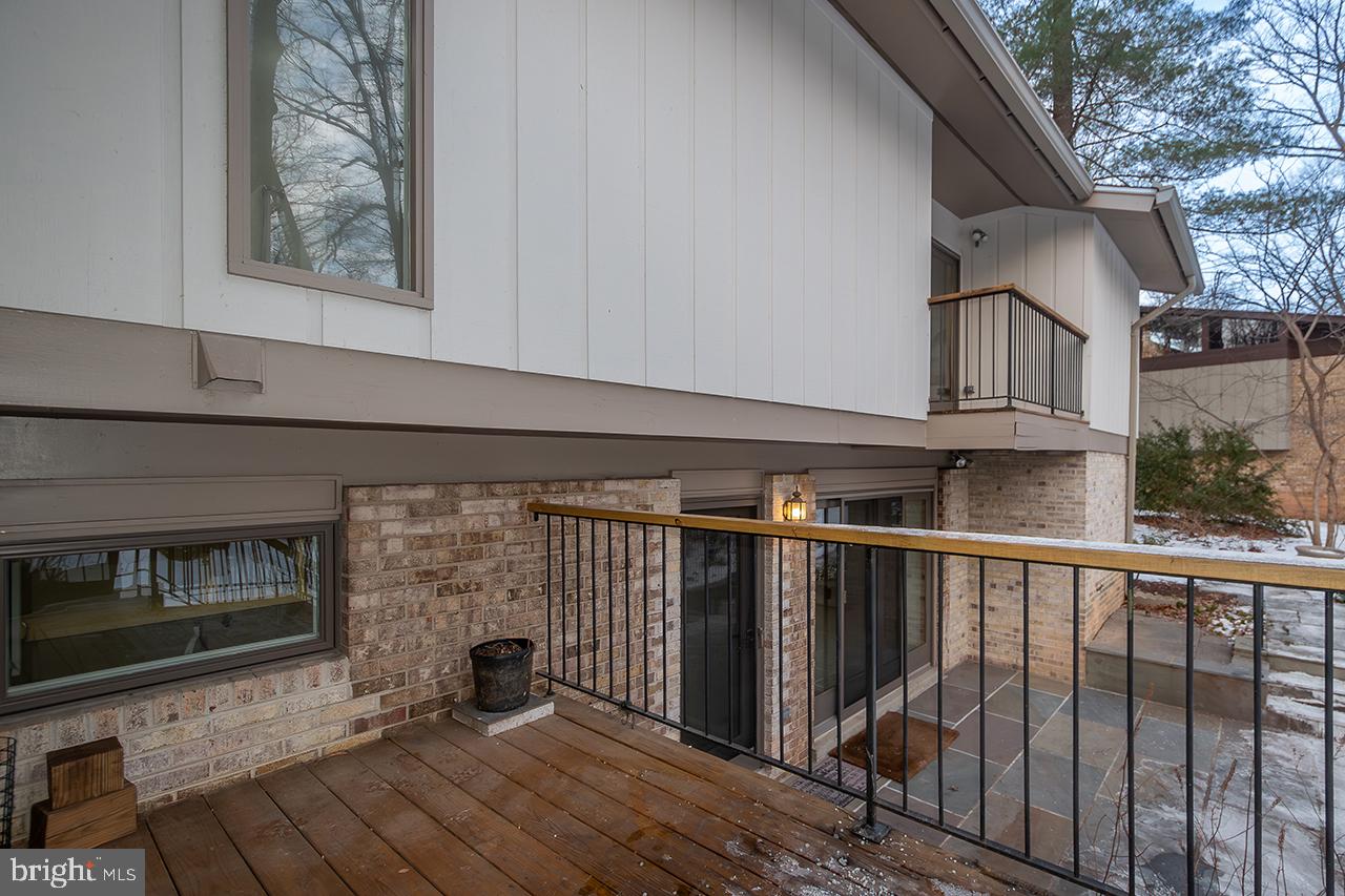 2529 Trophy Lane Reston, VA 20191 - Photo 13 of 69 a view of a porch with wooden floor and a fireplace