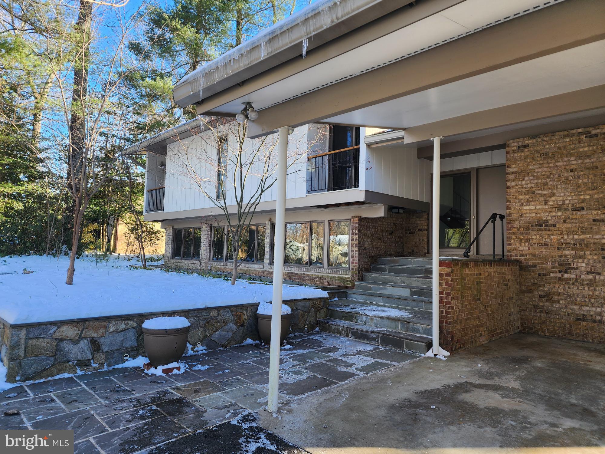 2529 Trophy Lane Reston, VA 20191 - Photo 3 of 69 a view of a patio with table and chairs with wooden fence and plants