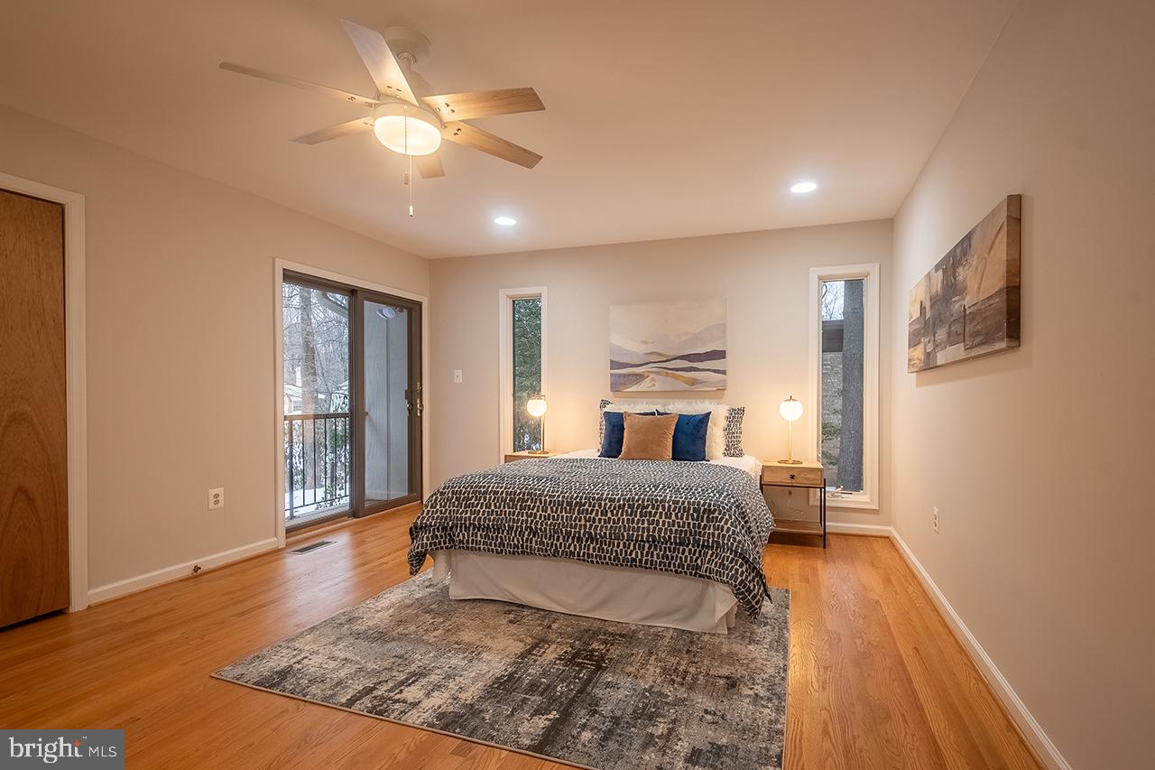 2529 Trophy Lane Reston, VA 20191 - Photo 31 of 69 a living room with a bed furniture and a ceiling fan