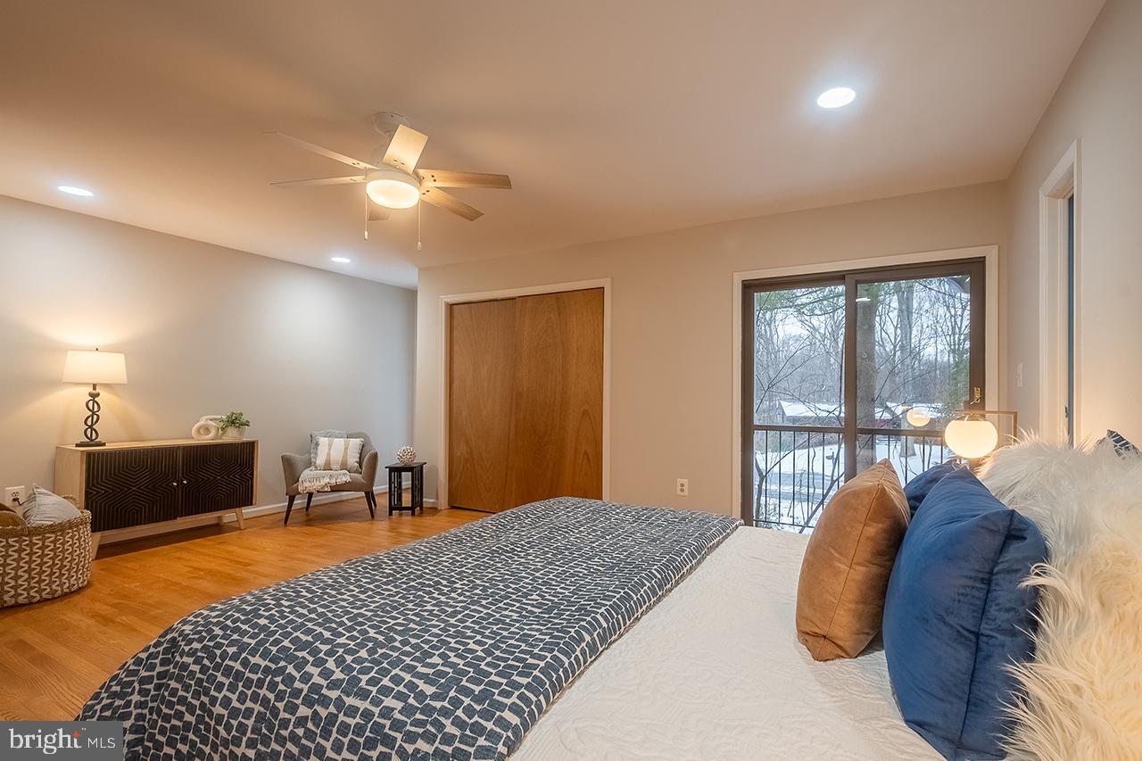 2529 Trophy Lane Reston, VA 20191 - Photo 32 of 69 a bedroom with a bed lamps and table