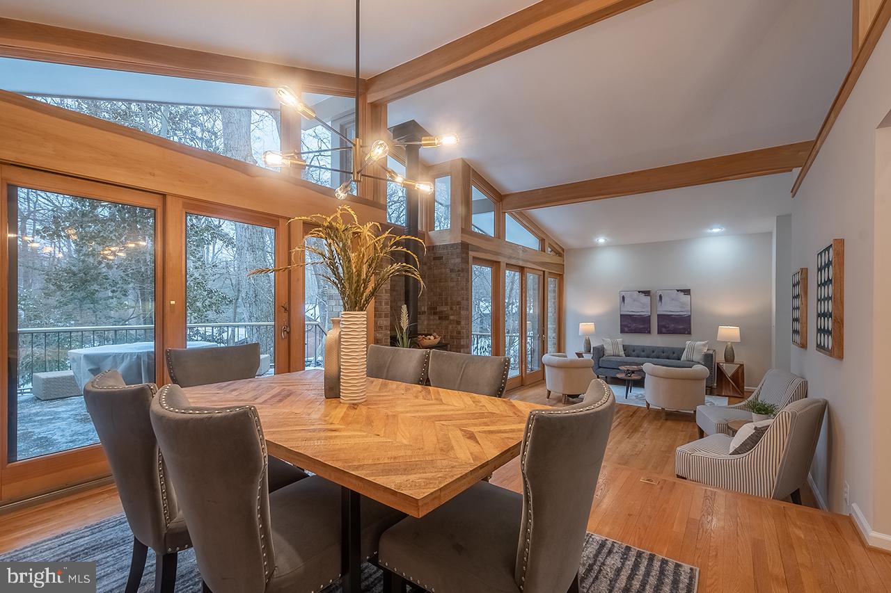 2529 Trophy Lane Reston, VA 20191 - Photo 5 of 69 a view of a dining room with furniture a chandelier and wooden floor