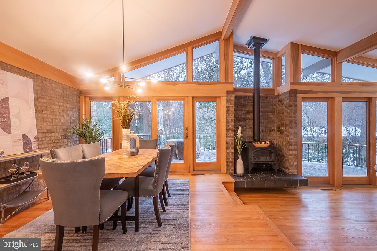 2529 Trophy Lane Reston, VA 20191 - Photo 6 of 69 a dining room with furniture water view and large windows