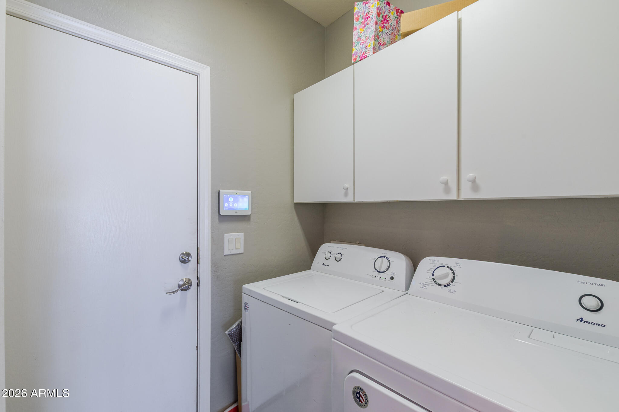 4521 West Moss Springs Road Anthem, AZ 85086 - Photo 35 of 35 a utility room with dryer and washer