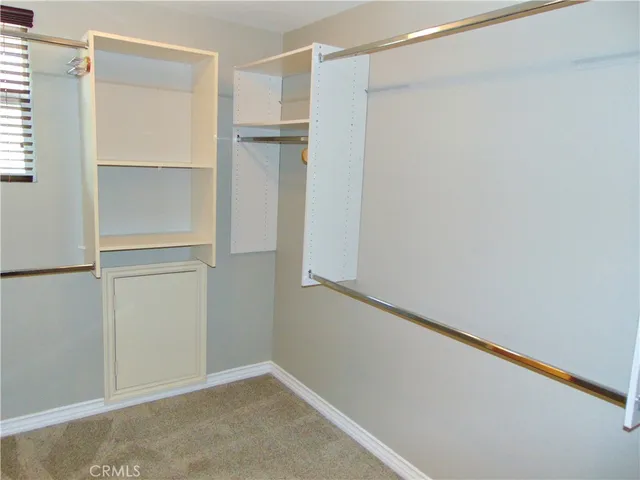 a bathroom with a granite countertop sink a toilet and a bathtub