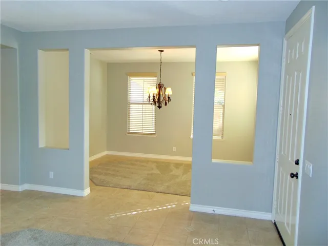 a view of a room with tiles and windows