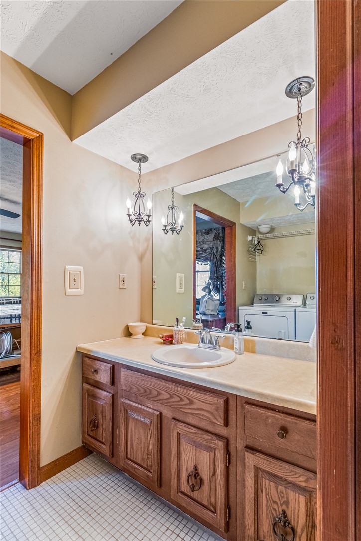 610 West Alex Bell Road Dayton, OH 45459 - Photo 18 of 36 This bright bathroom features a single vanity, ample storage, and stylish lighting.