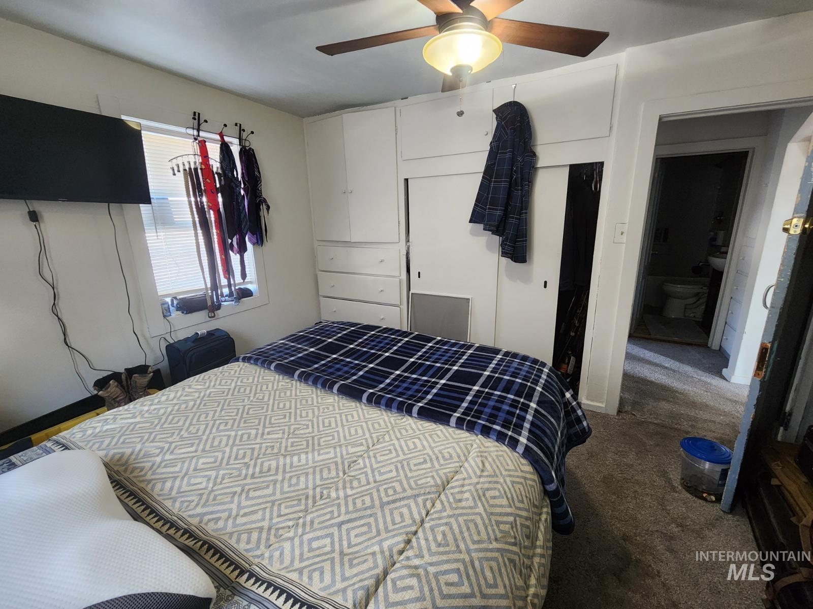 514 North 11th Street Nyssa, OR 97913 - Photo 7 of 33 Carpeted bedroom with ceiling fan and baseboards