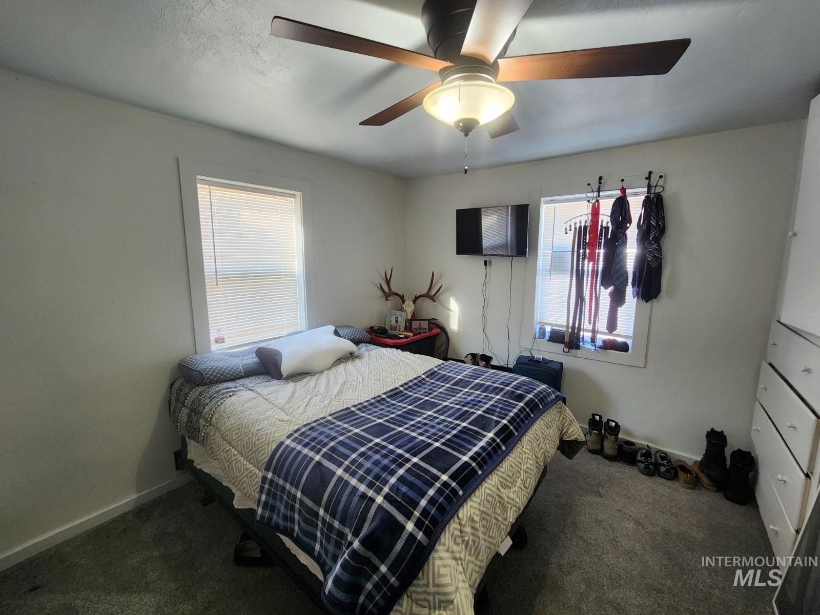514 North 11th Street Nyssa, OR 97913 - Photo 8 of 33 Bedroom featuring carpet flooring and ceiling fan