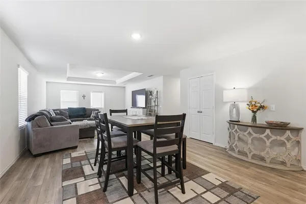 a kitchen with lots of counter top space and dining table