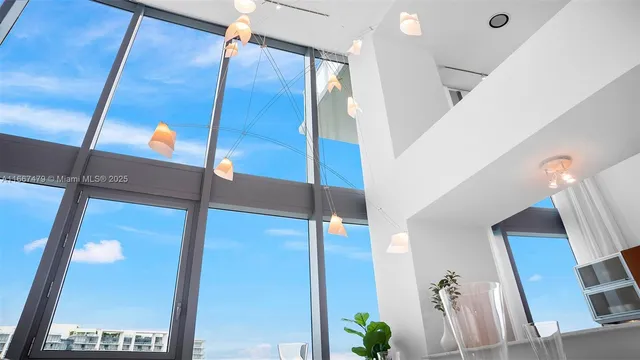 a view of living room with a sink and wooden floor