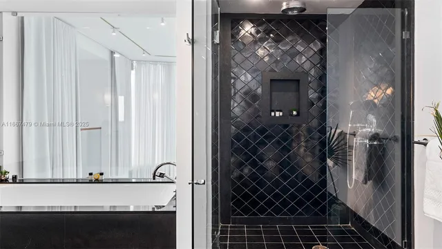 a bathroom with a granite countertop toilet sink and mirror