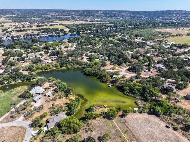 a view of a lake in middle of the town
