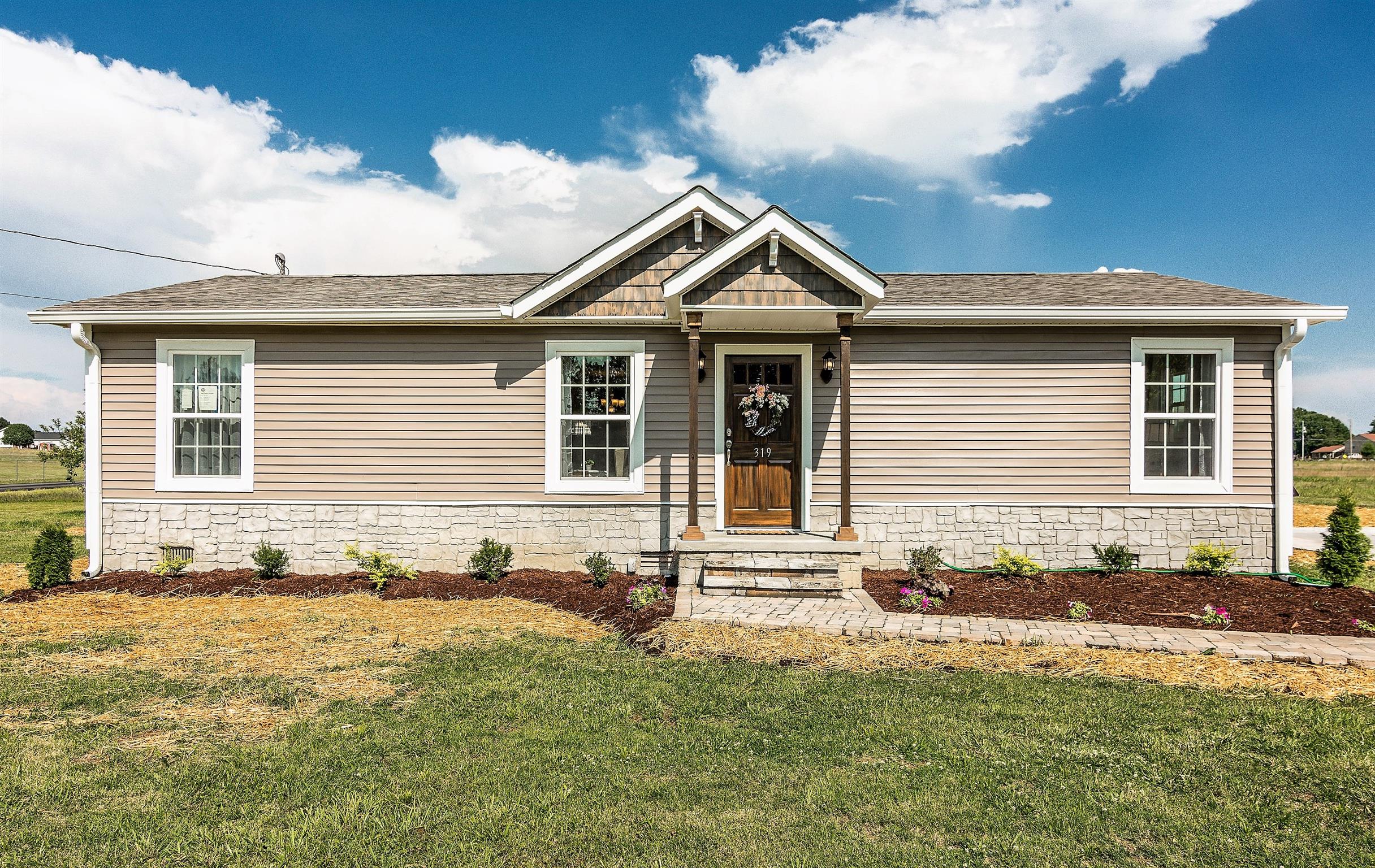 319 Airport Road Portland, TN 37148 - Photo 1 of 29 a front view of a house with yard