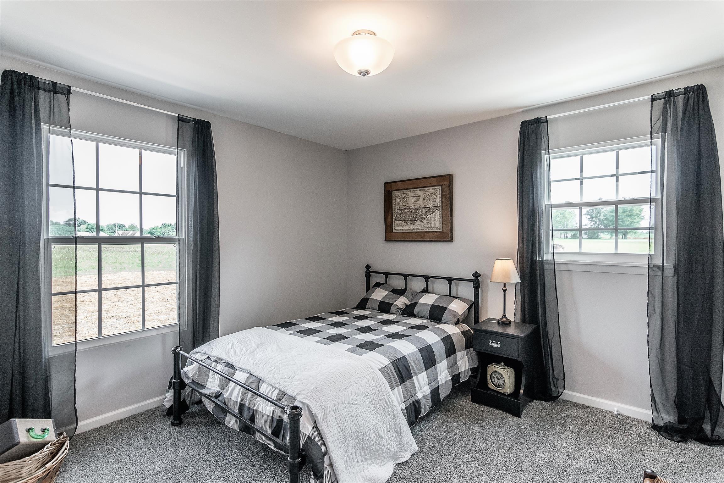 319 Airport Road Portland, TN 37148 - Photo 23 of 29 a bedroom with a bed and a window