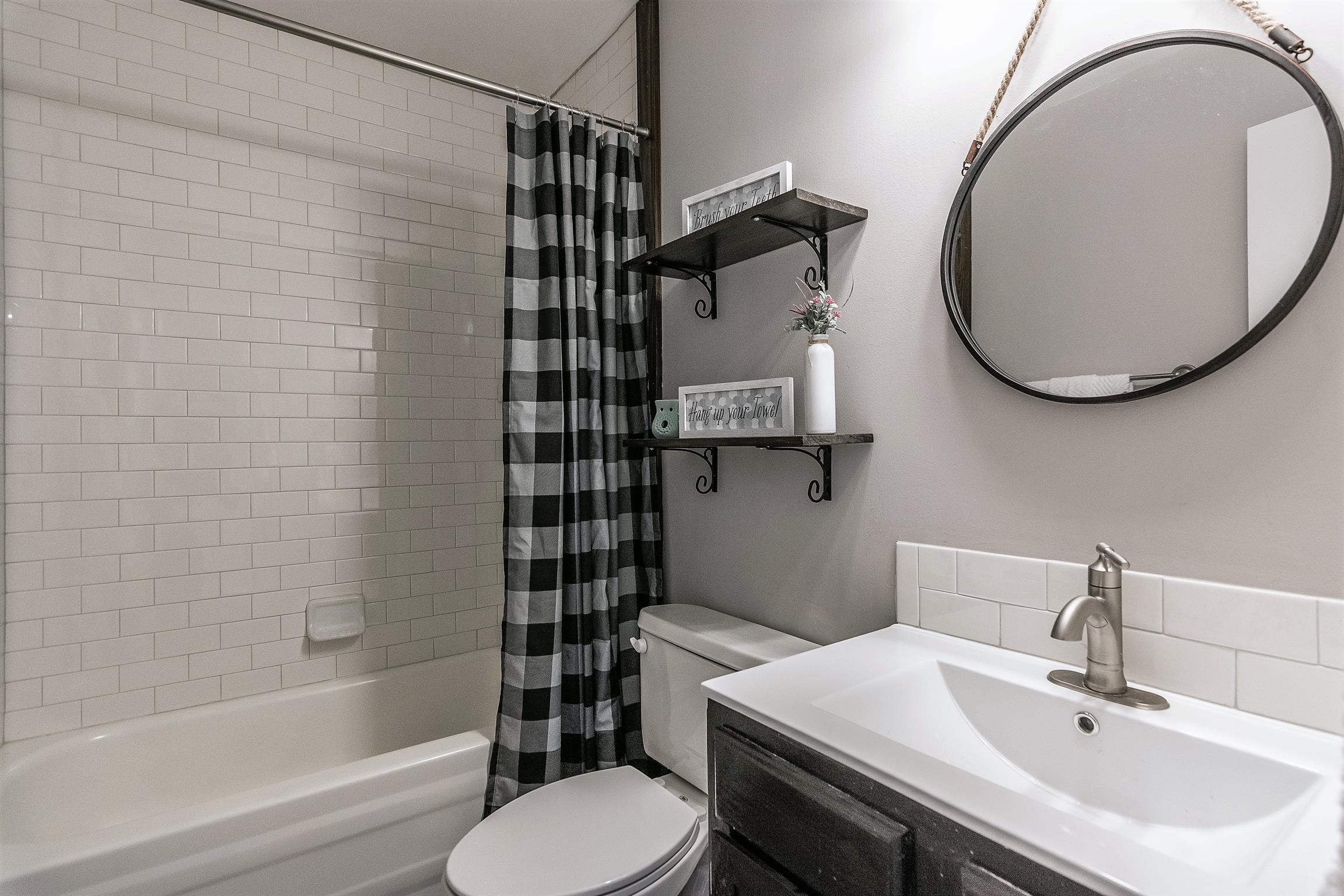 319 Airport Road Portland, TN 37148 - Photo 25 of 29 a bathroom with a sink toilet and shower