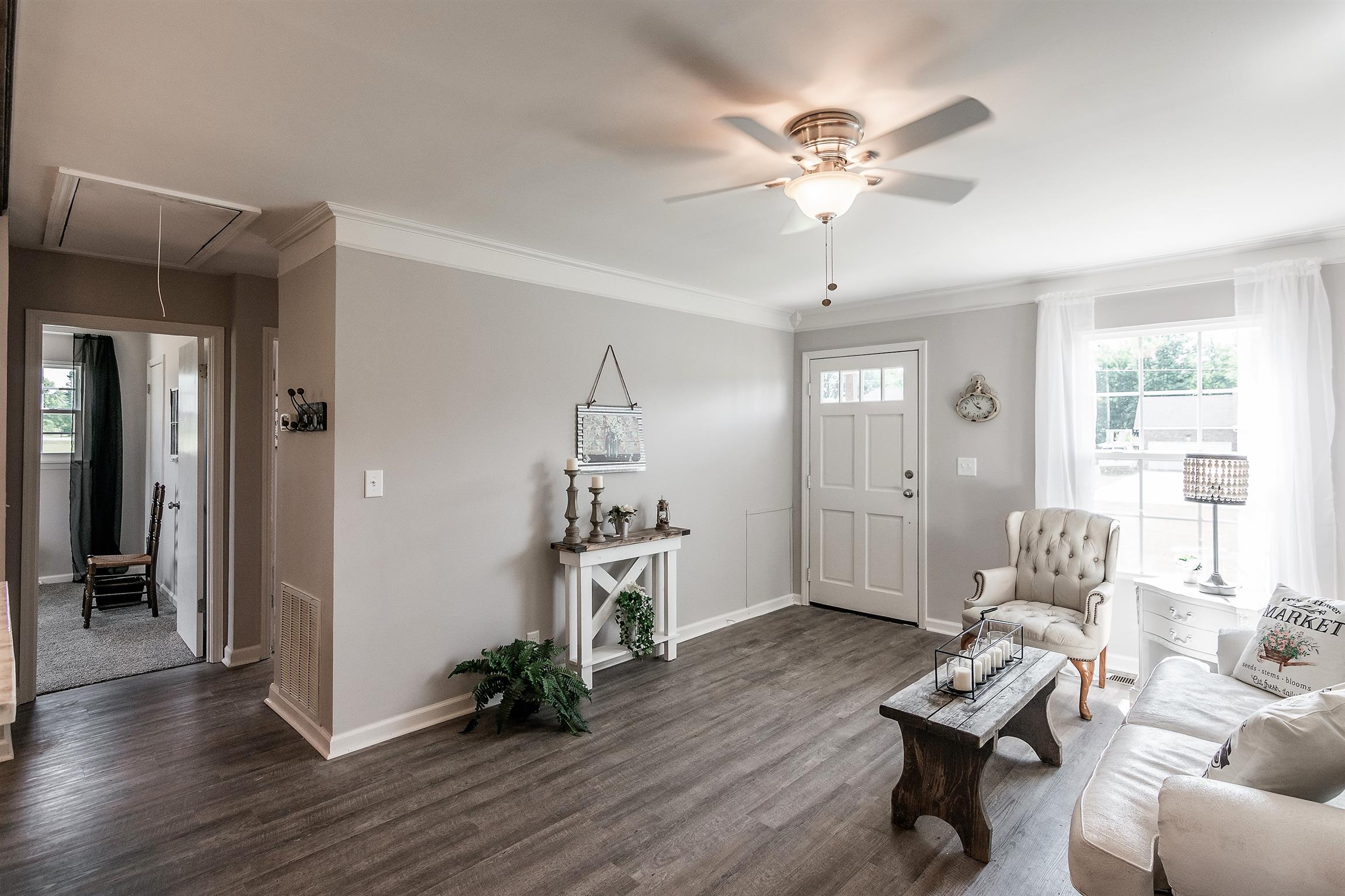 319 Airport Road Portland, TN 37148 - Photo 5 of 29 a living room with furniture and a chandelier